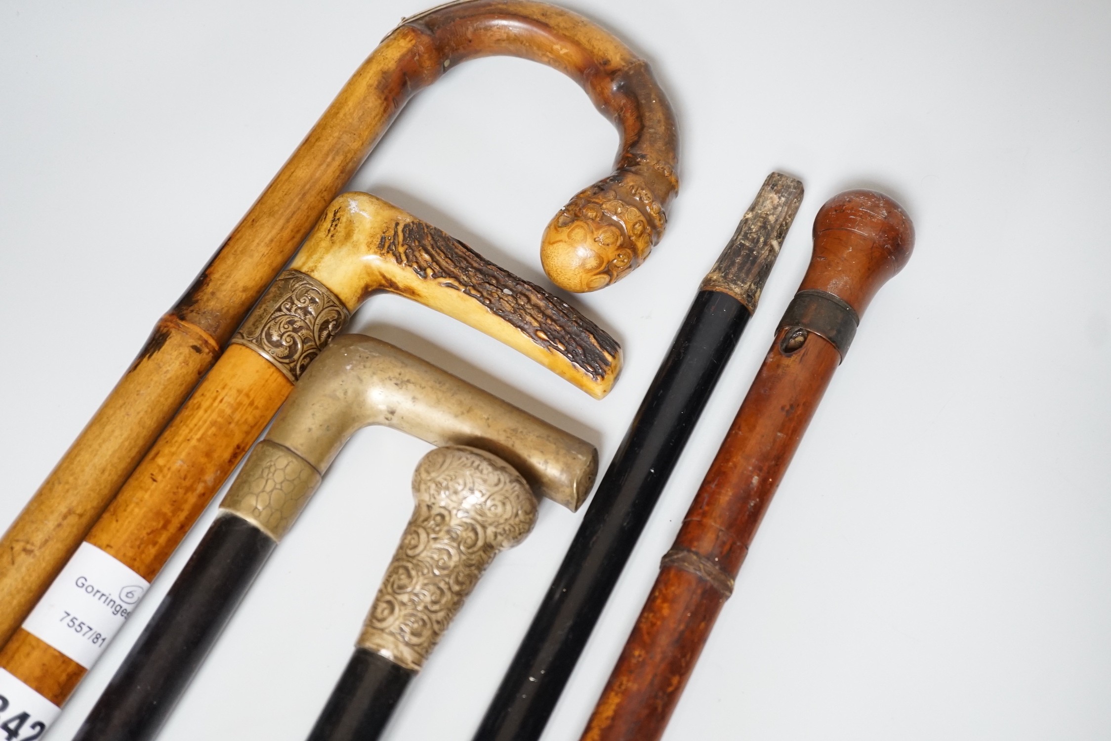 Two Victorian silver mounted walking sticks, a sword stick and three other sticks (6)